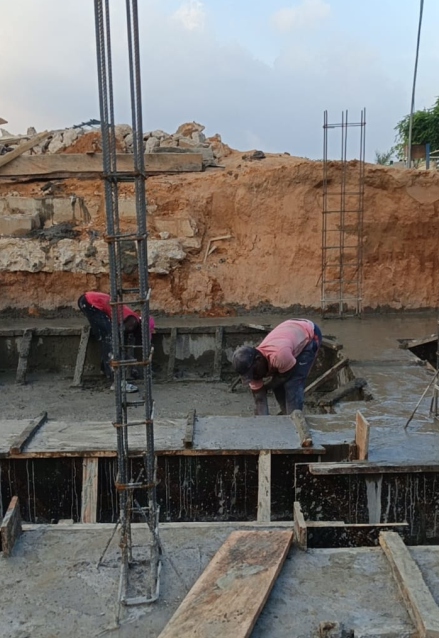 Workers handling concrete works